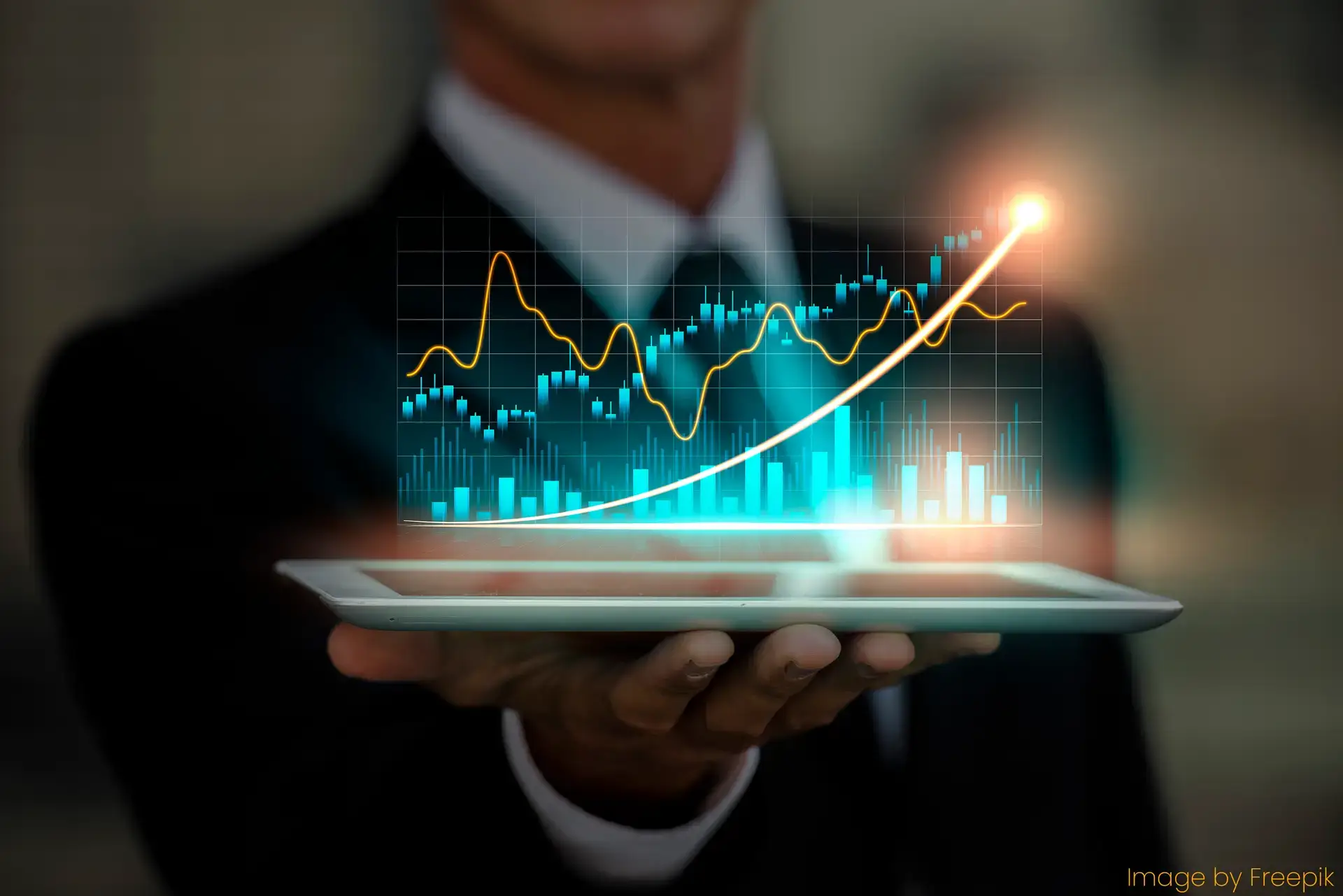 business person holding tablet with three dimensional graph hovering above it