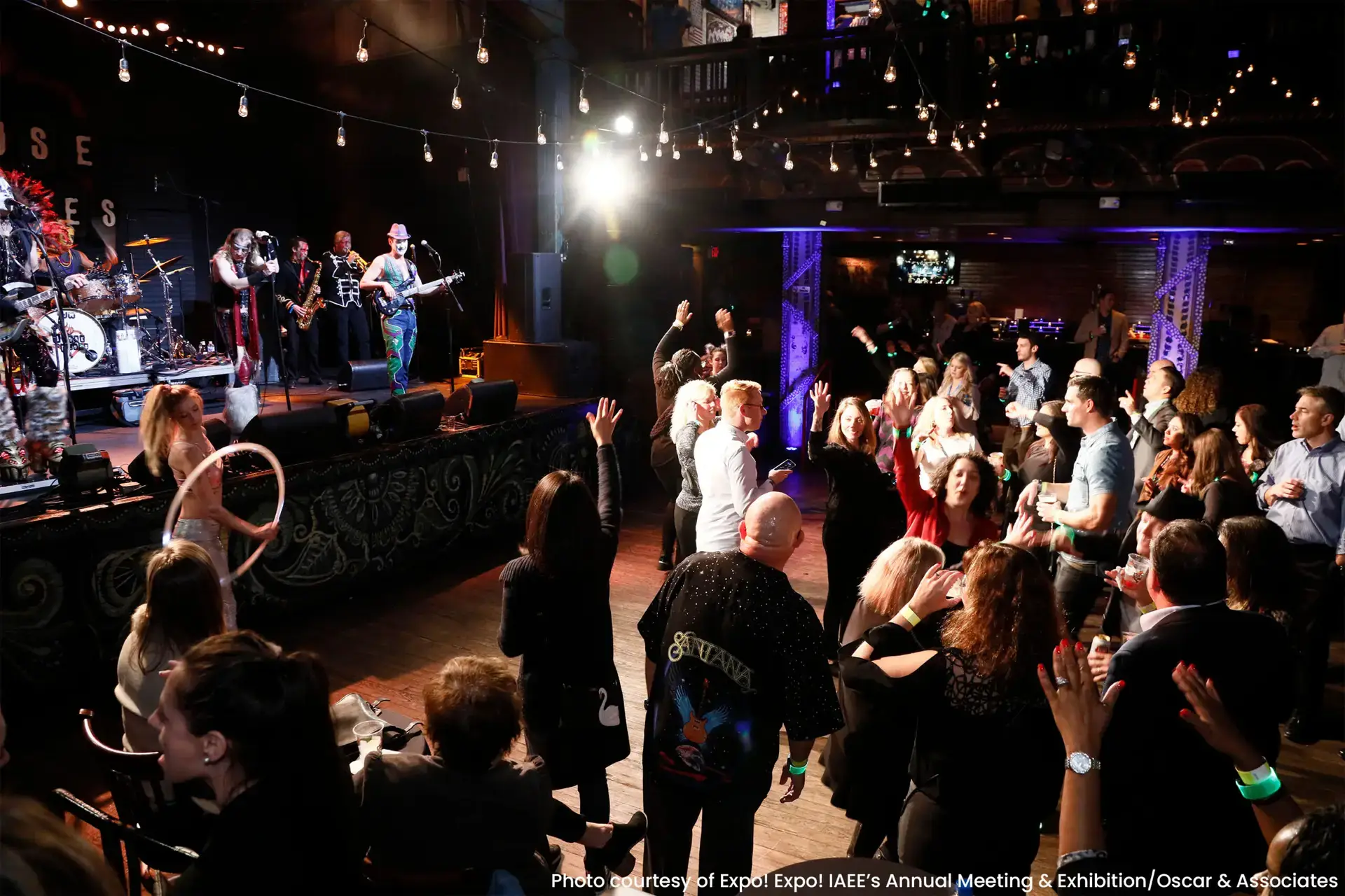 crowd dancing while band plays