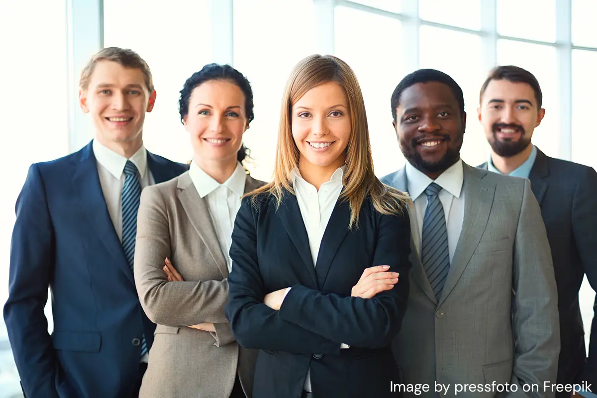 diverse business people facing forward and smiling