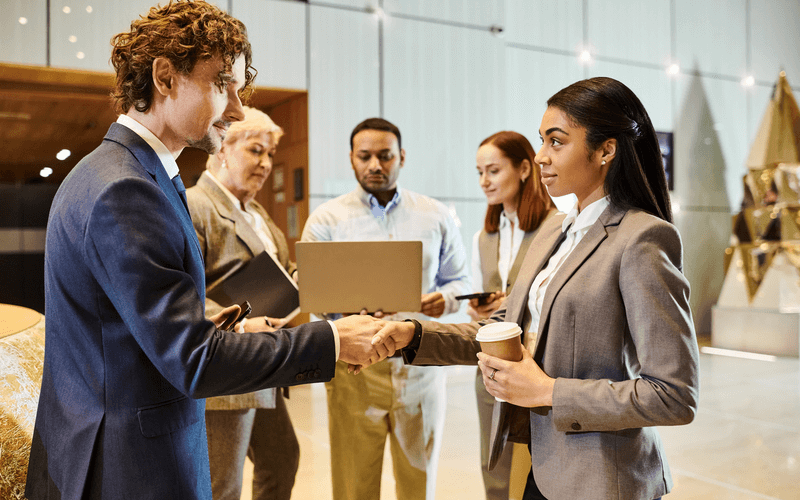 Man and woman on event floor making a renewal decision.